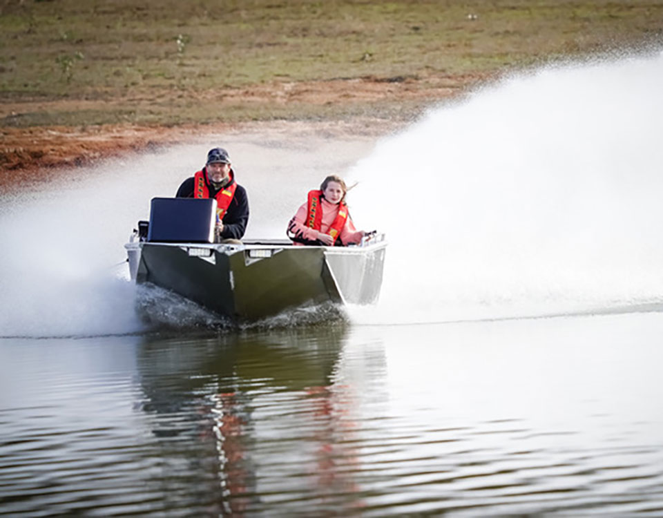 Alloy Tek boat gliding along the top of the water